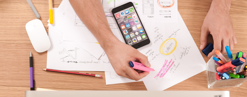 person writing on white paper