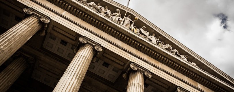 low angle photography of beige building