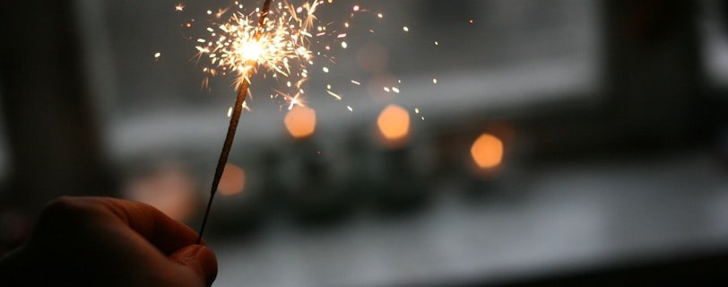 person holding sparkler