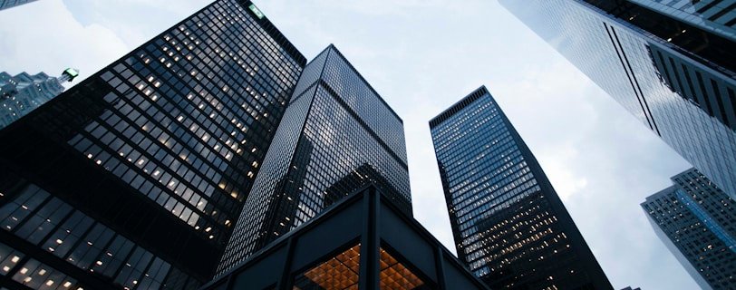 low angle photo of city high rise buildings during daytime