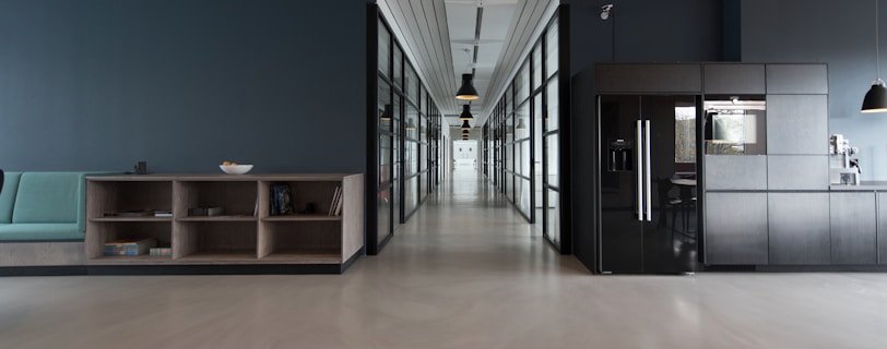 architectural photography of black and brown hallway