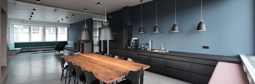 room with pendant lamps and rectangular dining set