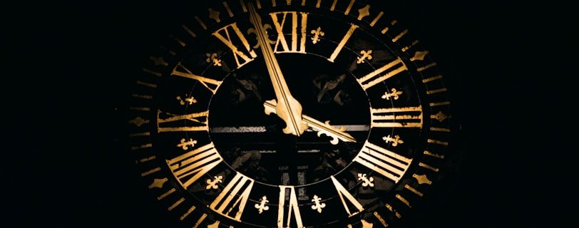 round black and brown analog clock