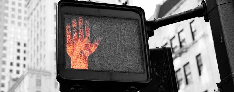 closeup photo of street go and stop signage displaying stop