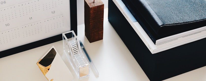 books and calendar on white table