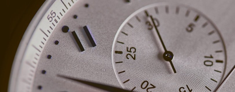 a close up of a silver watch face