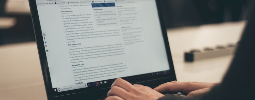 person typing on laptop computer