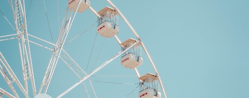 people riding on ferris wheel