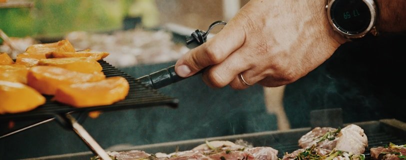 person grilling meat