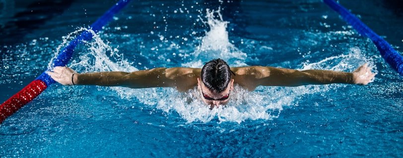 man doing butterfly stroke