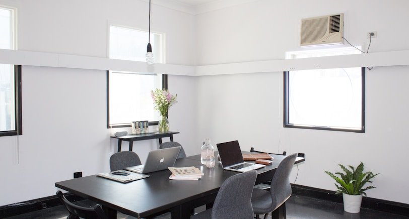 rectangular brown wooden table with chairs