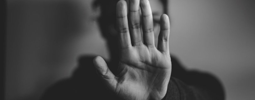 close-up photography of person lifting hands