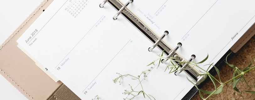 white and browm notebook