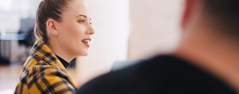 woman wearing yellow and black plaid shirt
