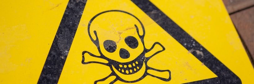 black and yellow poison sign