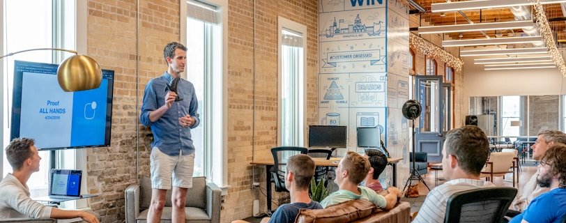 man standing in front of group of men