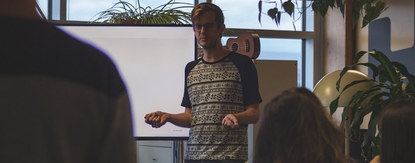 man standing near board