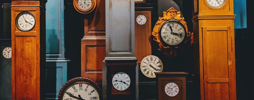 brown wooden framed analog clock