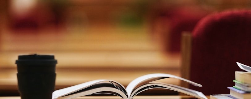 book page on brown wooden table