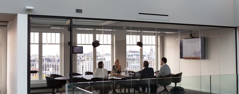 people sitting on chair inside building