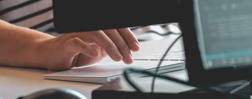 person using computer on table