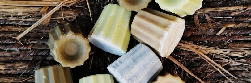 a group of soaps sitting on top of a wicker table