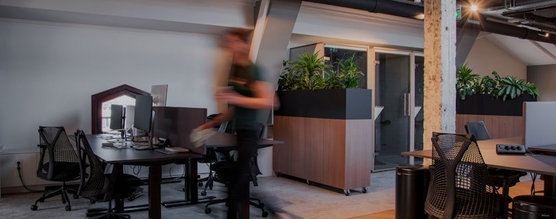 a blurry photo of a man in an office